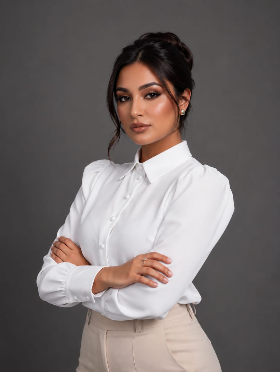 Portrait of Katty Taylor Griffin, book marketing specialist, in a white collared shirt with arms folded
